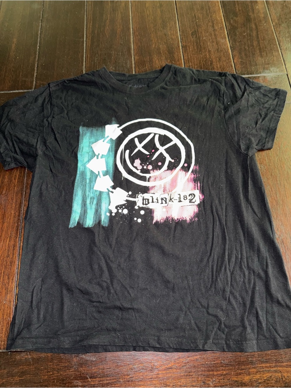 Blink-182 Logo Graphic Tee in Black with Teal and Pink Accents